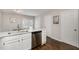 Modern kitchen sink with stainless steel dishwasher and hardwood floors at 48 Fashion Pl, Durham, NC 27705