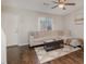Cozy living room with a plush sectional sofa, modern decor, and plenty of natural light at 48 Fashion Pl, Durham, NC 27705