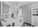 Modern bathroom with dual vanities, stylish mirrors, and ample storage space at 501 Mallard Ave, Durham, NC 27701