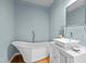Stylish bathroom featuring a modern freestanding tub, vessel sink, and sleek fixtures at 501 Mallard Ave, Durham, NC 27701