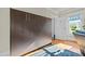 Bedroom featuring a modern Murphy bed with wooden finish and lots of natural light at 501 Mallard Ave, Durham, NC 27701