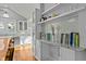Open concept kitchen with white cabinetry, granite counters and access to a dining area at 501 Mallard Ave, Durham, NC 27701