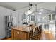Spacious kitchen featuring white cabinets, stainless steel appliances, and a large butcher block island at 501 Mallard Ave, Durham, NC 27701
