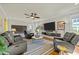 Comfortable living room with contemporary furniture, a ceiling fan, and decorative accents at 501 Mallard Ave, Durham, NC 27701