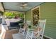 Charming front porch with rocking chairs and a swing, perfect for relaxing outdoors at 501 Mallard Ave, Durham, NC 27701