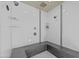 Modern shower with dual shower heads, clean white tiles and grey accent tiles at 501 Mallard Ave, Durham, NC 27701