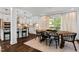 Bright dining room with a large wooden table and black chairs at 5525 Sandy Trail Dr, Knightdale, NC 27545