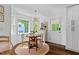 Bright breakfast room with a round table, natural lighting, and a view to the backyard at 5525 Sandy Trail Dr, Knightdale, NC 27545