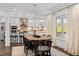Bright dining room featuring a chandelier and a view of the backyard at 5525 Sandy Trail Dr, Knightdale, NC 27545