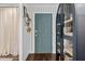 Entryway with blue door, dark wood floors, and stylish cabinet at 5525 Sandy Trail Dr, Knightdale, NC 27545