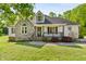 Charming home with stone facade, dormer window and covered front porch at 5525 Sandy Trail Dr, Knightdale, NC 27545