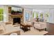 Cozy living room with fireplace, comfortable seating, and an open layout at 5525 Sandy Trail Dr, Knightdale, NC 27545