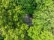 An aerial shot shows the house surrounded by tall green trees at 608 Valen Ct, Chapel Hill, NC 27516