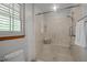 Bathroom featuring a glass door shower with built-in bench and overhead shower head at 608 Valen Ct, Chapel Hill, NC 27516