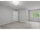 Spacious bedroom featuring neutral paint, vinyl floors, and natural light from the large window at 608 Valen Ct, Chapel Hill, NC 27516