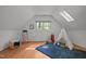 Bright bonus room with light wood floors, vaulted ceilings, skylight, and cozy teepee at 608 Valen Ct, Chapel Hill, NC 27516