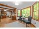Breakfast nook with wood trim windows and view of the landscaping outside at 608 Valen Ct, Chapel Hill, NC 27516