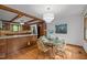 Open-concept dining area with wood floors next to the kitchen at 608 Valen Ct, Chapel Hill, NC 27516