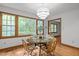 Dining room with wood floors and natural light and a view of the trees outside at 608 Valen Ct, Chapel Hill, NC 27516