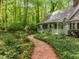 Charming white home with a welcoming front porch and beautifully landscaped garden path at 608 Valen Ct, Chapel Hill, NC 27516