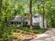 Charming two-story home with a welcoming front porch and lush landscaping with a brick walkway at 608 Valen Ct, Chapel Hill, NC 27516