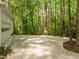 Spacious two car garage, with a wide driveway surrounded by lush green trees at 608 Valen Ct, Chapel Hill, NC 27516