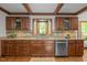 Well-appointed kitchen with granite countertops, stainless steel appliances, and custom cabinetry with great natural light at 608 Valen Ct, Chapel Hill, NC 27516