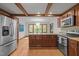 Spacious kitchen featuring a center island with bar seating, stainless steel appliances, and eat in kitchen at 608 Valen Ct, Chapel Hill, NC 27516