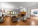 Inviting living room with hardwood floors, a cozy fireplace, and French doors leading to another room at 608 Valen Ct, Chapel Hill, NC 27516