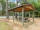 A picnic shelter and picnic tables provide ample seating for community gatherings at 608 Valen Ct, Chapel Hill, NC 27516