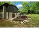 Backyard with brickwork, updated siding, and outdoor entertaining space at 6421 Arrington Rd, Raleigh, NC 27607