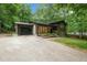 Charming two-story home with brick and siding exterior, lush landscaping, and a two-car garage at 6421 Arrington Rd, Raleigh, NC 27607