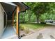 Well-maintained front yard with lush lawn, mature trees, and curb appeal at 6421 Arrington Rd, Raleigh, NC 27607