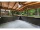 Relaxing screened porch with ceiling fan and views of the backyard at 6421 Arrington Rd, Raleigh, NC 27607