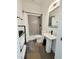 Modern bathroom featuring a tiled shower, sleek sink, and stylish fixtures at 665 Lonach Ln, Roxboro, NC 27574