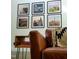 Cozy living room detail with a modern couch, decorative pillow, and wall art, creating a welcoming space at 665 Lonach Ln, Roxboro, NC 27574