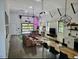 Open-concept living room with modern design, featuring high ceilings and an indoor games area at 665 Lonach Ln, Roxboro, NC 27574