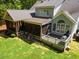 Aerial view of the backyard showcasing a screened-in porch and deck, perfect for outdoor entertaining at 6819 Rainwater Rd, Raleigh, NC 27615
