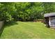Well-maintained backyard with a large grassy area, ideal for recreation and outdoor activities at 6819 Rainwater Rd, Raleigh, NC 27615