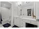Elegant bathroom featuring a vanity, tub, shower, and giraffe statue, creating a luxurious spa-like experience at 6819 Rainwater Rd, Raleigh, NC 27615