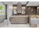 Modern bathroom with dual sinks, custom cabinetry, and glass-enclosed shower at 6819 Rainwater Rd, Raleigh, NC 27615