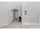 Bright bedroom featuring neutral walls, trim detail, and plush carpet at 6819 Rainwater Rd, Raleigh, NC 27615