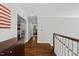 Hallway with wood floors and white trim showcasing access to other rooms at 6819 Rainwater Rd, Raleigh, NC 27615