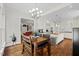 Open kitchen design with island seating, updated appliances, and seamless access to living spaces at 6819 Rainwater Rd, Raleigh, NC 27615