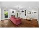 Spacious living room with hardwood floors, built-in shelves and elegant lighting at 6819 Rainwater Rd, Raleigh, NC 27615