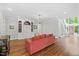 Spacious living room with custom built-ins, hardwood floors, and abundant natural light at 6819 Rainwater Rd, Raleigh, NC 27615