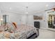 Large main bedroom featuring plush carpet, comfortable bed, and an en suite bathroom at 6819 Rainwater Rd, Raleigh, NC 27615