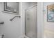Accessible bathroom featuring a glass-enclosed shower and safety grab bars for ease of use at 708 Copperline Dr # 101, Chapel Hill, NC 27516