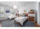 Bright bedroom features two twin beds, soft lighting, and stylish decor at 708 Copperline Dr # 101, Chapel Hill, NC 27516