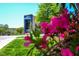 Commercial building with vibrant flowers in the foreground, enhancing street appeal at 708 Copperline Dr # 101, Chapel Hill, NC 27516
